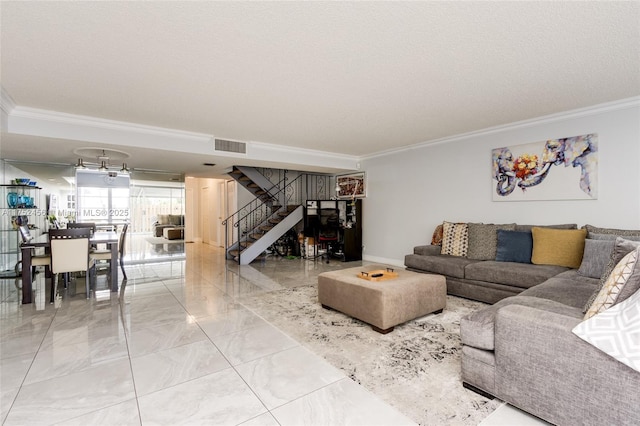 living room featuring marble finish floor, visible vents, stairway, and ornamental molding