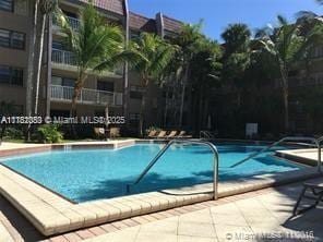 community pool featuring a patio area