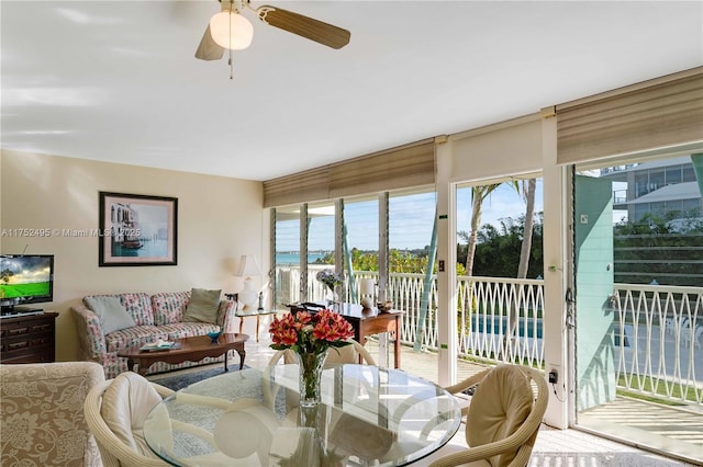 interior space featuring a water view and ceiling fan