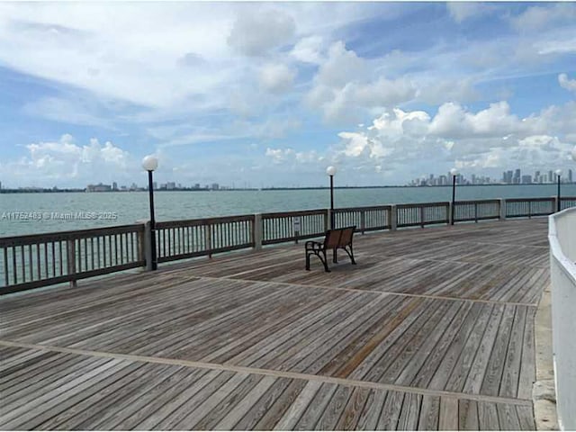 wooden terrace with a water view