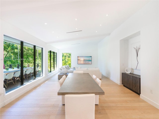 dining space with baseboards, recessed lighting, and light wood-style floors