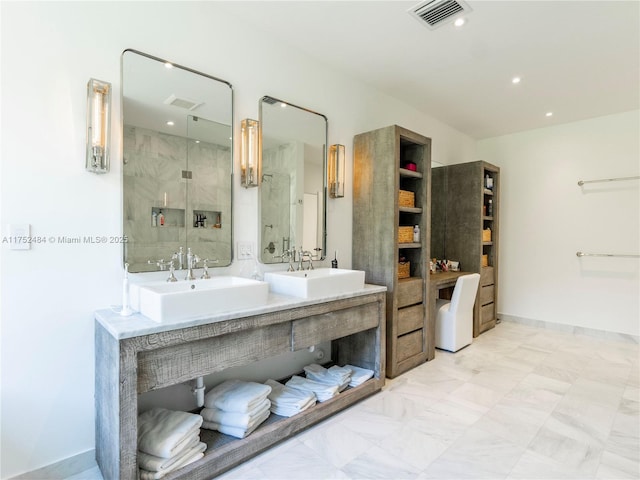 bathroom with double vanity, visible vents, a sink, and recessed lighting