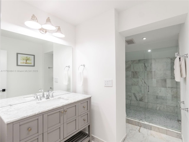 bathroom featuring vanity, visible vents, baseboards, marble finish floor, and a shower stall