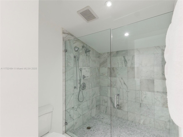 bathroom featuring visible vents, a stall shower, toilet, and recessed lighting