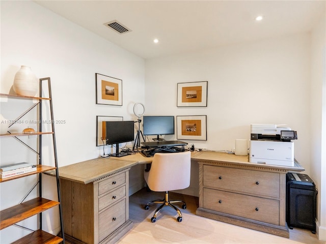 office area with visible vents and recessed lighting