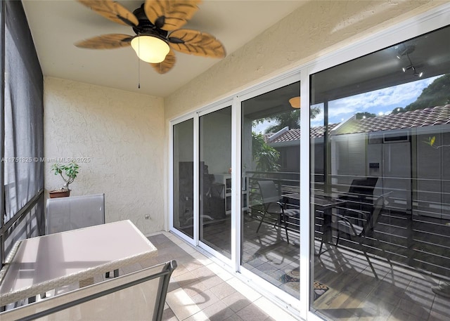 balcony with outdoor dining area and a sunroom