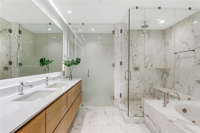 full bathroom with a marble finish shower, marble finish floor, a sink, and a tub with jets