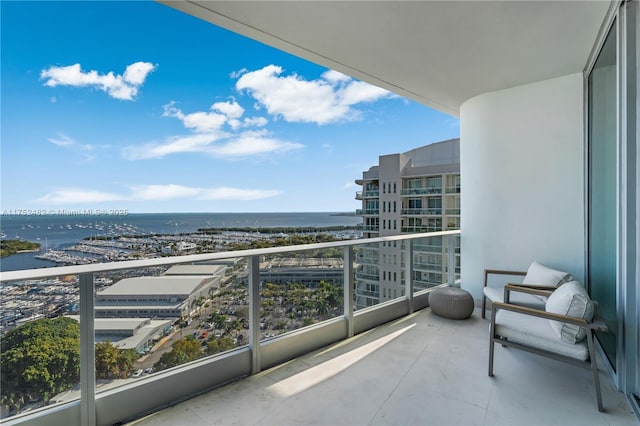 balcony featuring a water view