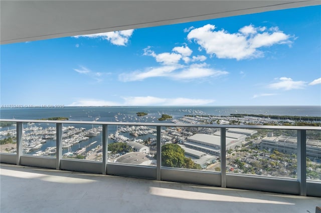 balcony featuring a water view