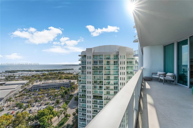 balcony with a view of city and a water view