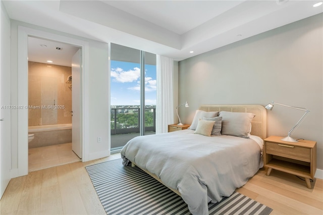 bedroom with connected bathroom, recessed lighting, baseboards, access to exterior, and light wood-type flooring