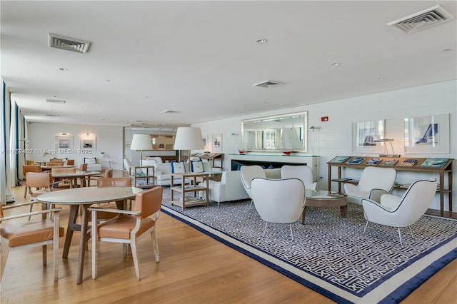 dining room featuring light wood-style floors, visible vents, and recessed lighting