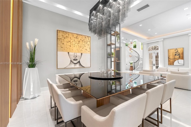 dining area with stairs, a tray ceiling, visible vents, and light tile patterned flooring