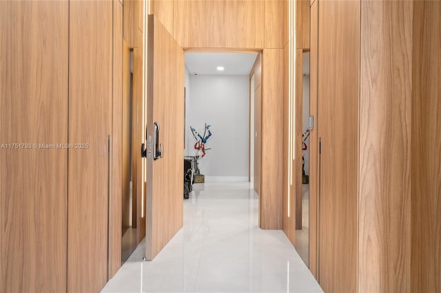 hallway featuring light tile patterned floors