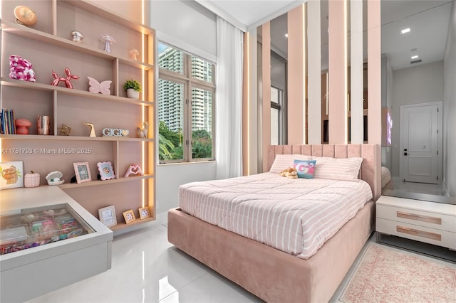 bedroom with light tile patterned floors