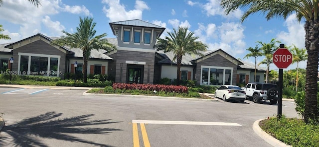 view of building exterior featuring uncovered parking