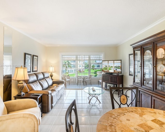 living area with ornamental molding and light tile patterned floors