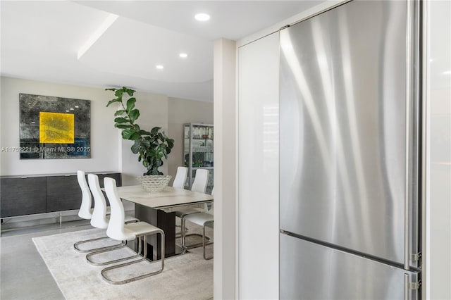 dining room with recessed lighting