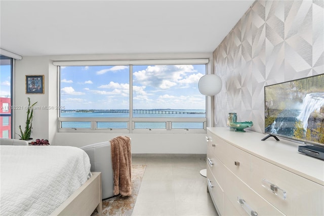 bedroom featuring light tile patterned flooring