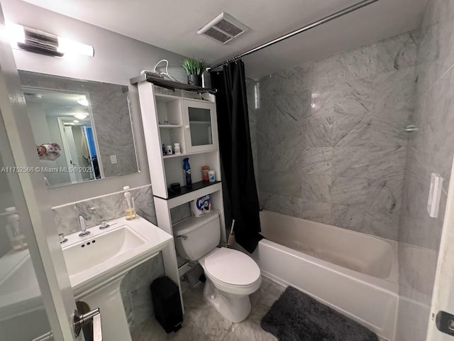 bathroom with shower / bath combo, visible vents, toilet, marble finish floor, and a sink