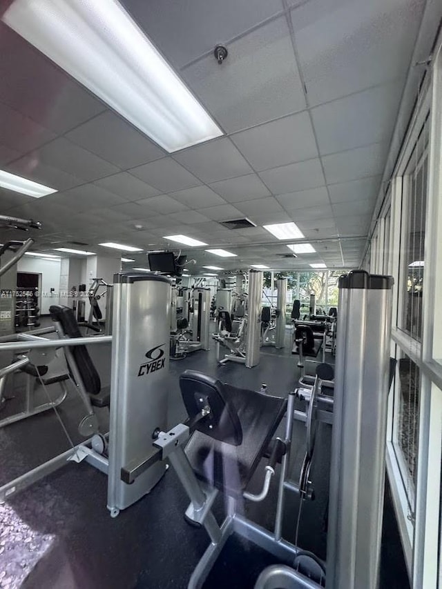 gym with visible vents and a paneled ceiling