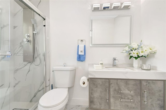 bathroom with vanity, baseboards, a marble finish shower, toilet, and marble finish floor