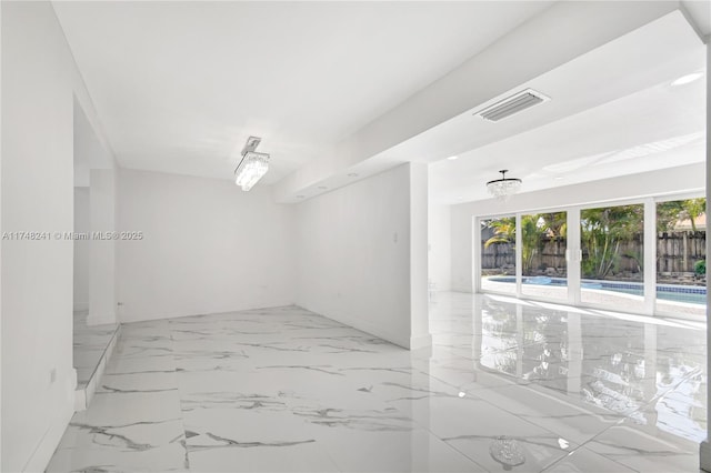 empty room with visible vents and marble finish floor