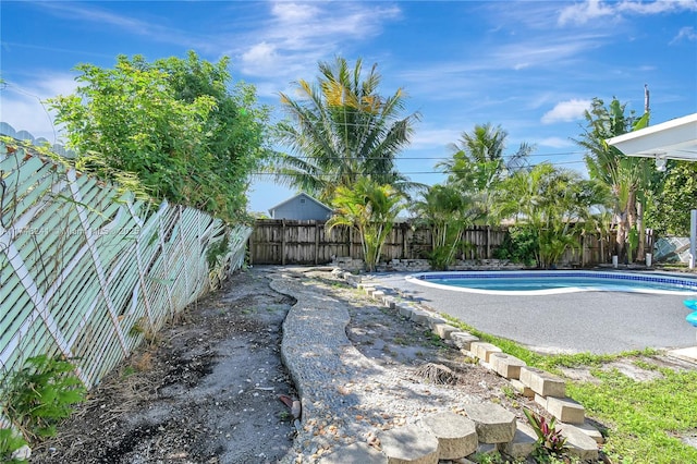view of swimming pool with a fenced backyard and a fenced in pool