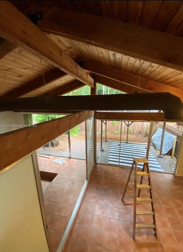 interior space with wooden ceiling and vaulted ceiling with beams