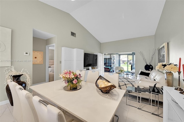 kitchen with light countertops, marble finish floor, visible vents, and white cabinetry