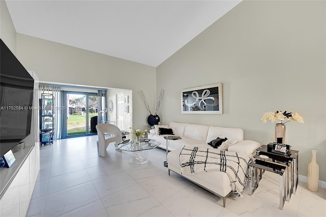 living room featuring high vaulted ceiling