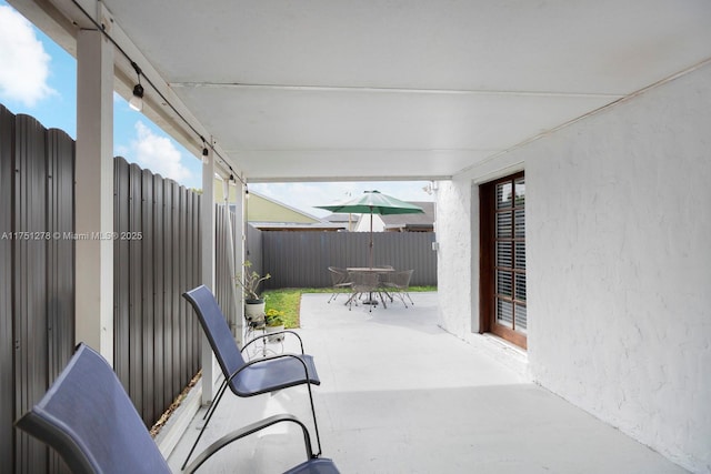 view of patio featuring a fenced backyard and outdoor dining space