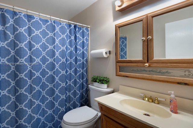 full bath featuring toilet and vanity