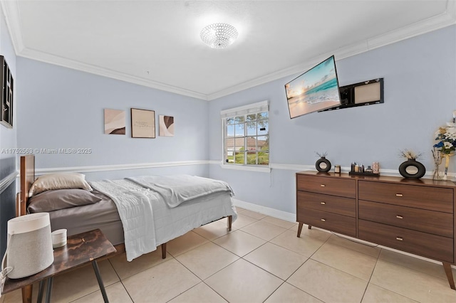 bedroom with baseboards, ornamental molding, and light tile patterned flooring