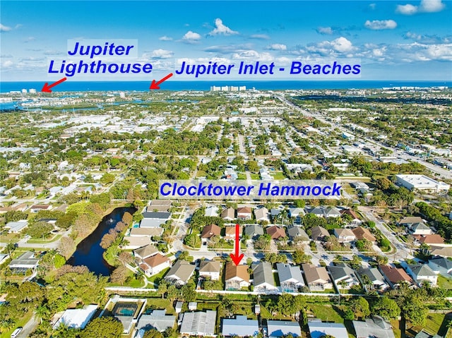 birds eye view of property featuring a water view and a residential view