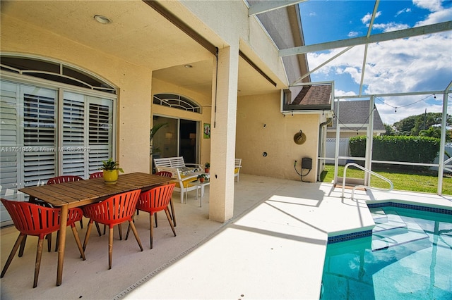 view of swimming pool with a lanai, a patio area, outdoor dining area, and a fenced in pool