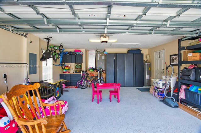 garage with electric panel, a garage door opener, and electric water heater