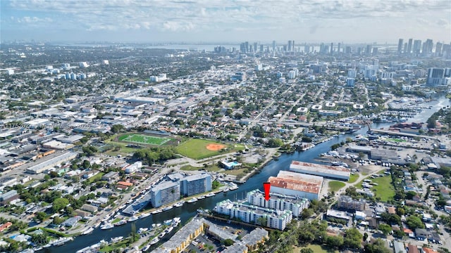 aerial view with a view of city and a water view