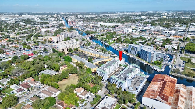 birds eye view of property featuring a water view and a view of city