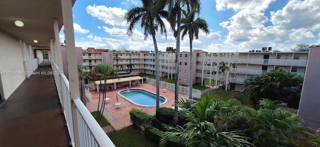 community pool with a patio area