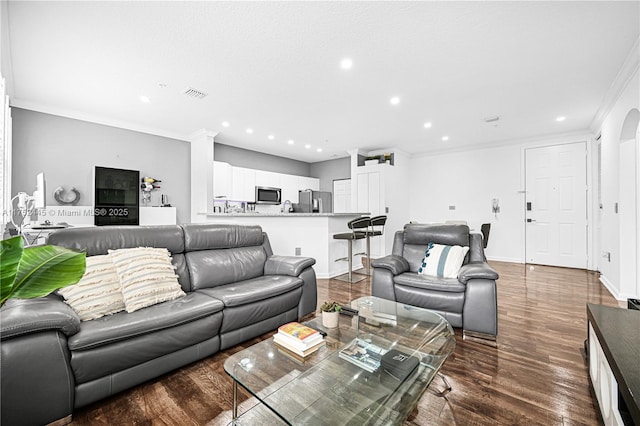 4704 SW 160th Ave Unit 224, Miramar, FL 33027 - living area with recessed lighting, crown molding, dark wood-style flooring, baseboards, and arched walkways