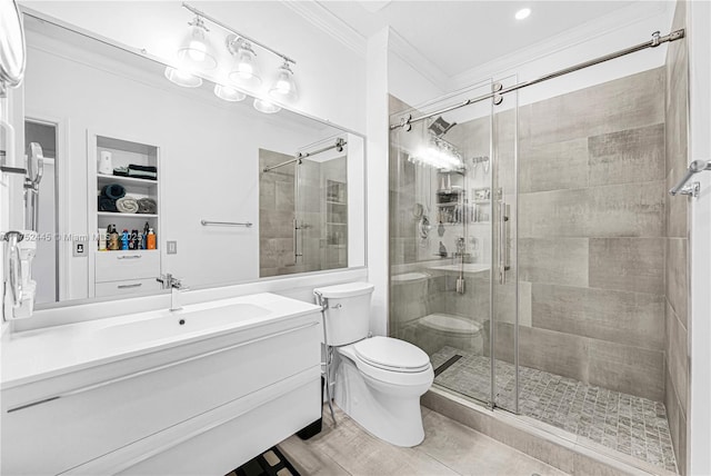 bathroom featuring a stall shower, vanity, toilet, and crown molding