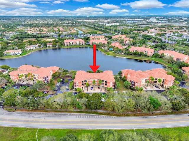 bird's eye view with a residential view and a water view