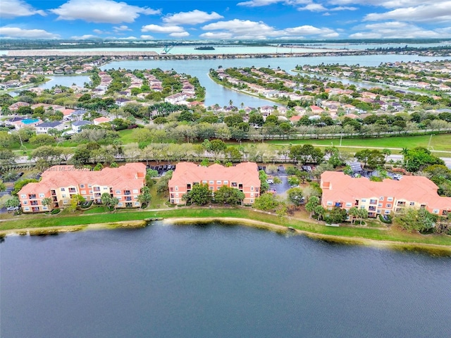 birds eye view of property featuring a water view and a residential view