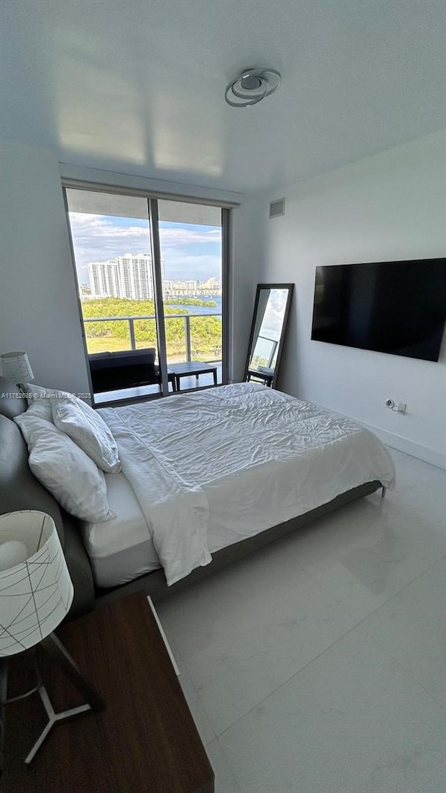 bedroom with visible vents and baseboards