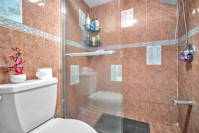 full bath with a stall shower and toilet