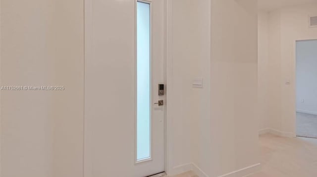 doorway featuring visible vents and baseboards