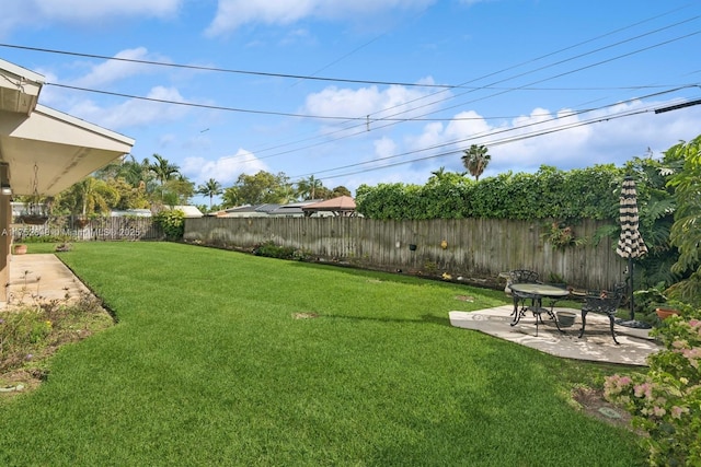 view of yard featuring a patio and a fenced backyard