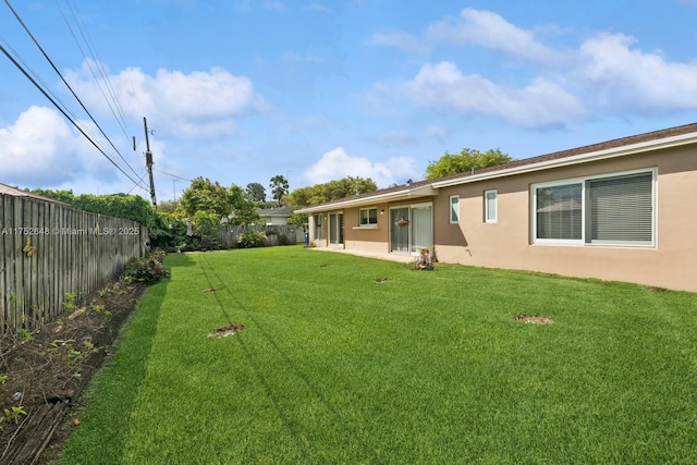 view of yard with a patio area and a fenced backyard