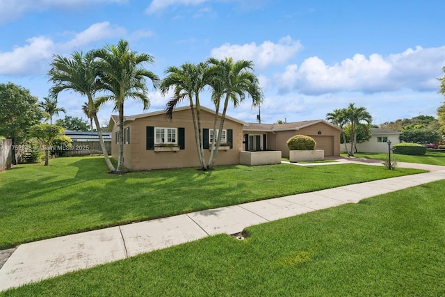 ranch-style house featuring concrete driveway, a front lawn, an attached garage, and fence